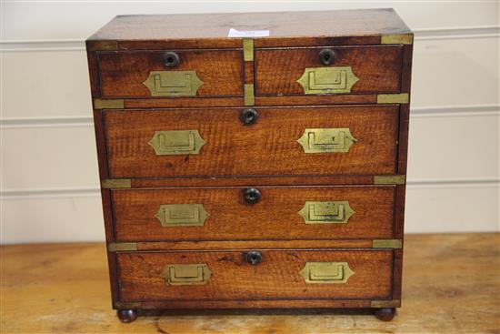 A Regency miniature brass inset mahogany campaign chest, width 12.5in. depth 6in. height 12.5in.